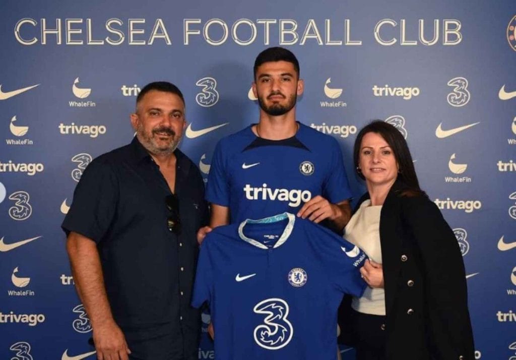 Armando Broja side by side with his father, Xhevahir, and mother, Bella Broja, on signing his contract with Chelsea.